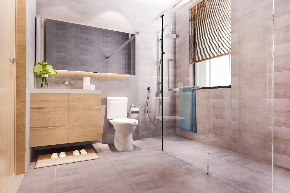 Ein modernes Badezimmer mit Glasdusche, Waschtisch aus Holz und Fenster mit Jalousien, das stilvoll beim täglichen Energie sparen hilft